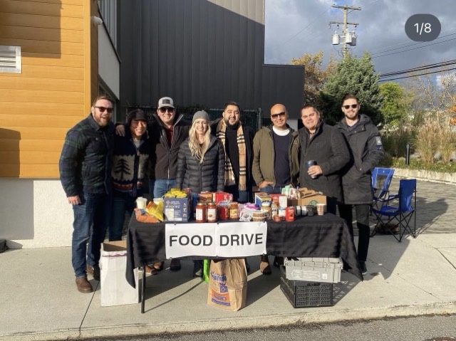 Our team at the food drive table collecting donations for the Langley Food Bank