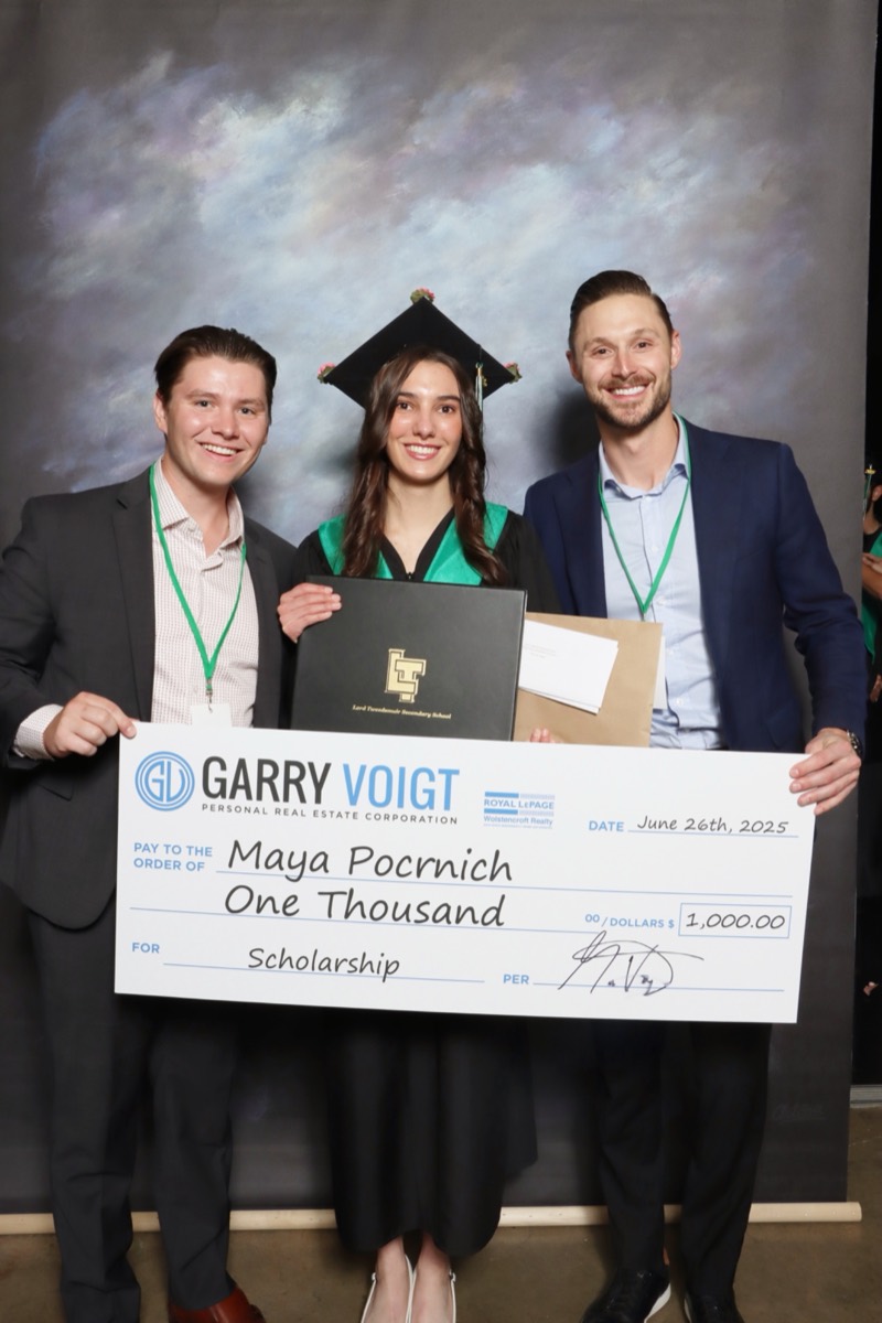 Our team presenting The Garry Voigt Real Estate Group Scholarship to a Lord Tweedsmuir Secondary graduate